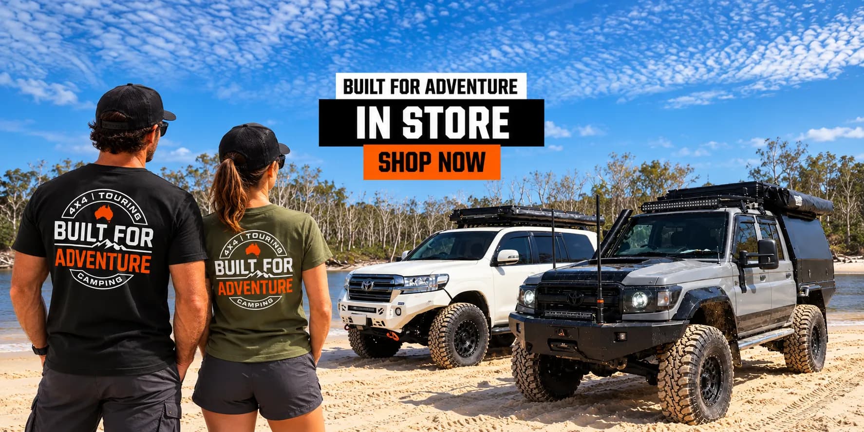 Built for Adventure in store, shop now: two people in Built for Adventure tees on a beach beside two 4x4s