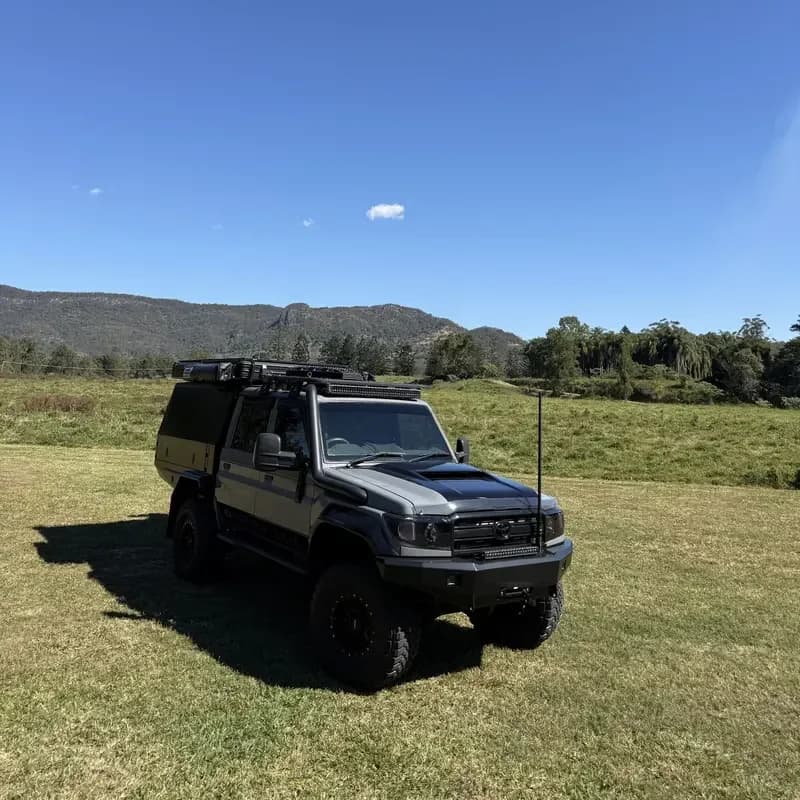 Drewsy's 79 parked in an open paddock under a blue sky.